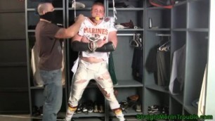 Tall redheaded football player bound gagged and stripped.