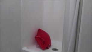 A depressed red balloon takes a shower because it is sad