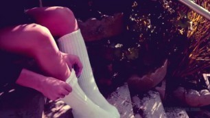 Girl plays with her white hooters socks and gets them dirty
