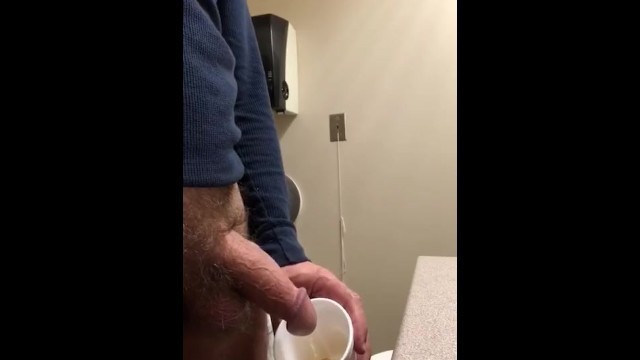 Daddy Chris peeing in a cup