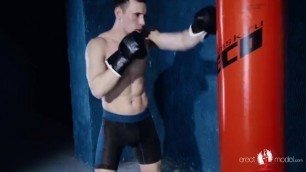 HOT STUD BOXER POUNDING ON PUNCHING BAG WITH BOXING GLOVES