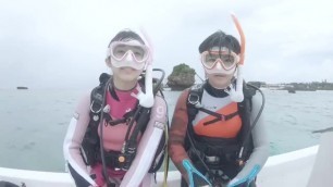 Two Japanese girls scuba diving in a TV program.