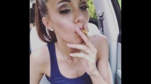 Beautiful girl smoking in her car