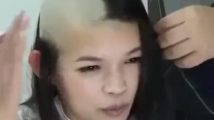 Beautiful asian gril shaves half of her head