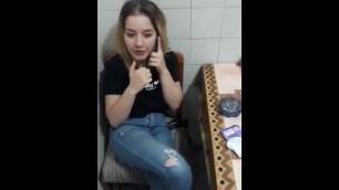 She sucks her while she talks to her boyfriend on the phone.