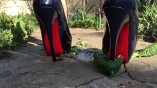 Sexy hot high heels foot crush of cucumbers