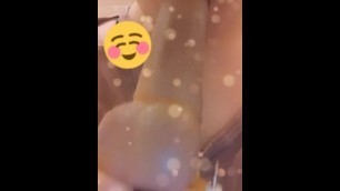 Deep throating dildo before masturbating in public bathroom