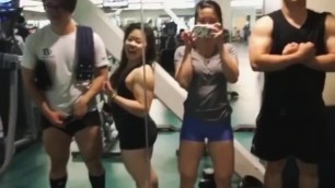 Asian Group posing in front of mirror