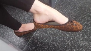 Camilla dangling ballet flats on public transport (candid view)