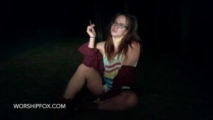 Hot brunette smokes in the mountains at night