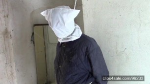 Suffering husband after milking (tied, hooded and with noose)