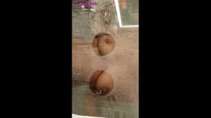 Pressing my boobs on the glass shower door