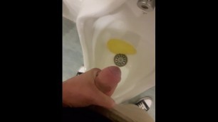 Pissing in public restroom and playing with my dick