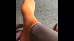 Self tickling on orange socks