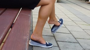 sexy feet in dangling sneakers