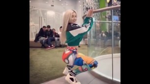 beautiful blonde with a leggings pokemon twerk pattern in a mall