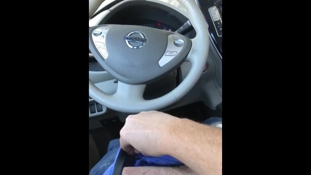 Jerking off in public in a car. Big white cock