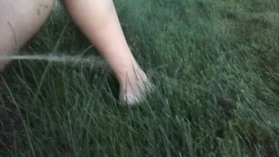 Girl Pees Outside in Grass