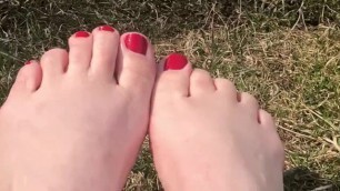 Outdoor Foot Play in Park Grass in Sneakers, Socks and Bare Feet