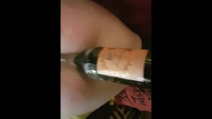 Young blond slut using bottle of wine