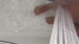 Playing with sexy feet and and legs in the shower