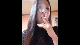 Pretty Asian smoking girl.