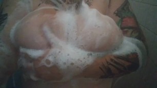 Natural, soapy tits in shower.