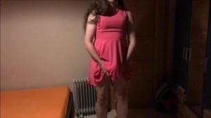 Sissy in pink dress strokes her cock with cumshot on face
