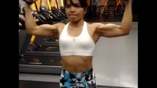 Thai FBB Milf pumping up her biceps 2