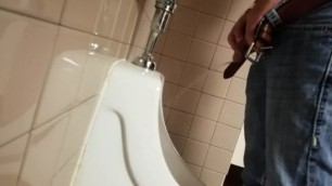 Yummy Cock Peeing into the Urinal Next to an Eager Voyeur.