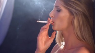 A hot blonde girl smokes a cigarette naked. Her perfect slim body is sexy!