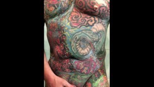 Jacques Kiros shows his tattooed and pierced body, jerks off and cums