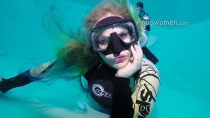 Elise scuba diving in wetsuit