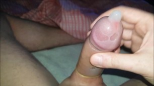 Edging my uncut cock in a condom
