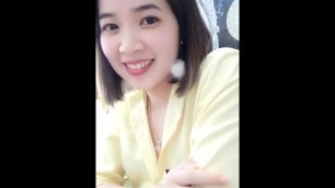 Vietnamese female staff shows off her chest