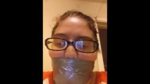 girl selfgagged with silver tape