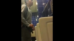 Spy men pissing in the toilet
