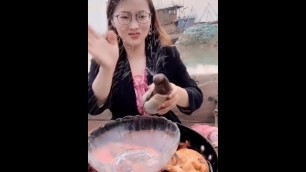 Asian woman eating a penis.