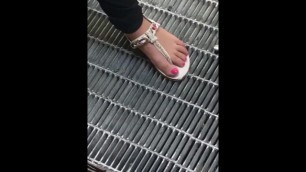Nice woman candid feet in sandals