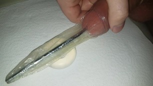 Urethral Sounding inside a condom, with cockring