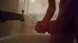 Horny guy masturbating in the shower