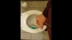 Jerk off at a public toilet and cum