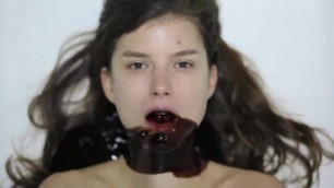 Chocolate poured down girl's mouth