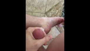 Shooting a big load of cum onto foot and floor