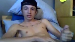 Young tattooed latino jerking off on cam