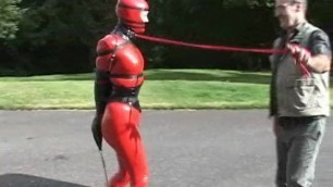 catsuit bondage doll walked on a leash