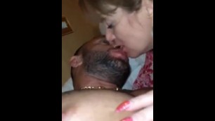 2 ladies spit kissing one young guy