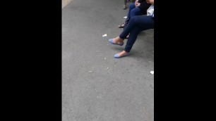 Sexy Woman Dangling in Blue Flats at the bus stop