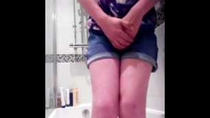 Girl desperatly pees her denim shorts