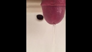 Close-Up of Pink Cock Pissing in Sink